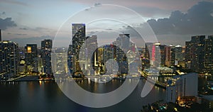 Miami Brickell in Florida, USA. Night cityscape of brightly illuminated shiny skyscraper buildings in downtown district