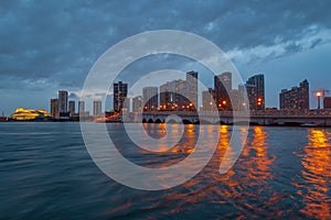 Miami city. Miami skyline panorama at dusk with skyscrapers over sea. Night downtown sanset.