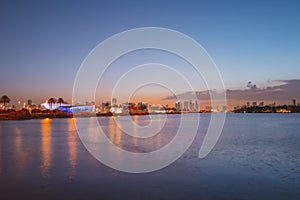 Miami city. Miami skyline panorama at dusk with skyscrapers over sea. Night downtown sanset.