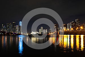 Miami city night. Miami Florida, sunset panorama with colorful illuminated business and residential buildings and bridge