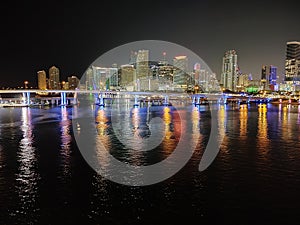 Miami city skyline panorama at dusk with urban skyscrapers and bridge over sea