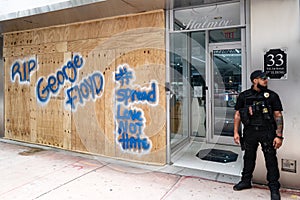 Miami Downtown, FL, USA - JUNE 4, 2020: Security guard Protects Business From destruction and Looting During US Protests