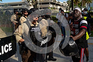 Miami Downtown, FL, USA - MAY 31, 2020: The conflict between American police and black people during the mass protests