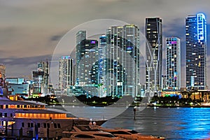 Miami downtown. Miami Florida at sunset, skyline of illuminated buildings and Macarthur Causeway bridge.