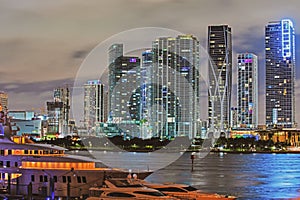Miami downtown. Miami Florida at sunset, skyline of illuminated buildings and Macarthur Causeway bridge.
