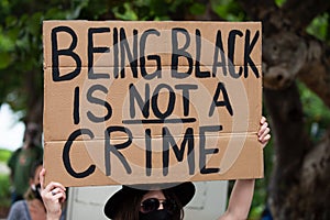 Miami, FL, USA - JUNE, 2020: Being black is not a crime poster. Black Lives Matter.