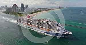 Miami, Florida travel destination. Aerial view of large cruise liner departing from port. Holiday vacation concept