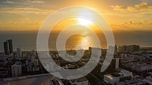 MIAMI, FLORIDA, USA - JANUARY 2019: Aerial drone panorama view flight over Miami. Sunrise above Atlantic ocean.
