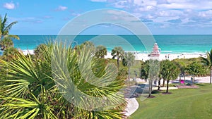 MIAMI, FLORIDA, USA - MAY 2019: Aerial drone panorama view flight over Miami beach. Sand, palm trees and sea from above.