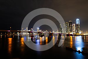 Miami night downtown. Miami Florida, sunset panorama with colorful illuminated business and residential buildings and
