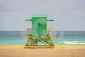 Miami South Beach lifeguard tower and coastline with cloud and blue sky. Sunny day in Miami beach.