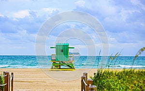 Miami South Beach skyline. Lifeguard tower in colorful Art Deco style and Atlantic Ocean at sunshine. Panorama of Miami