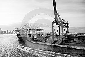 Miami, USA - March, 18, 2016: maritime container port with cargo ship, cranes. Sea port, terminal or dock. Freight