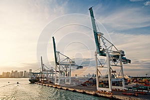 Sea port, terminal or dock. Maritime container port with cargo ship, cranes. Freight, shipping, delivery, logistics