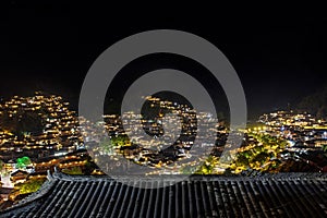 Miao village at night in valley of mountains