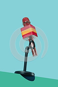 mic patterned with the spanish flag in a stand