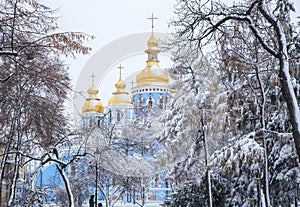 Michael`s Golden Domed Cathedral in winter snowfall. Kiev. Ukraine