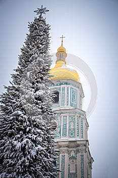 Michael`s Golden Domed Cathedral in winter snowfall. Kiev. Ukraine