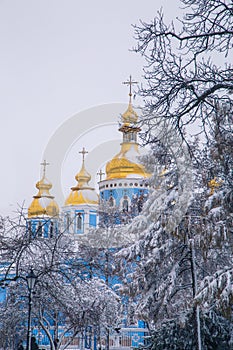 Michael`s Golden Domed Cathedral in winter snowfall. Kiev. Ukraine