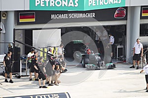 Michael Schumacher exits pit garage