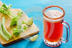 Michelada beer with tomato juice, spicy sauce and lemon, mexican drink cocktail in mexico