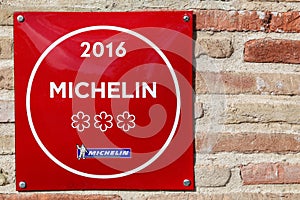 Michelin restaurant 3 stars symbol on a wall