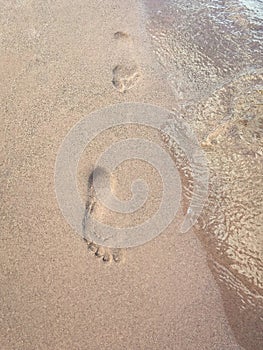 Two footprints in the sand
