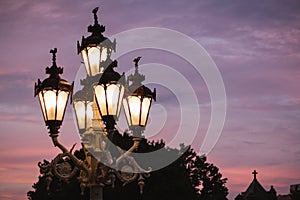 Michigan State Capitol classic city lights shine over a sunset in Lansing