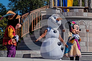 Mickey , Minnie and Olaf Mickeys Royal Friendship Faire on Cinderella Castle in Magic Kingdom 3