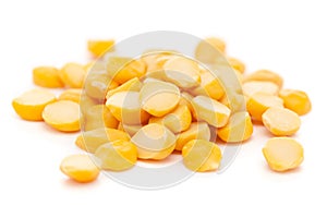 Micro close-up and details of Organic Indian Bengal Gram Cicer arietinum or split yellow chana dal  isolated over white backgrou