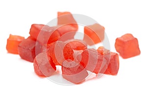 Micro close-up and details of Organic Indian red tutti frutti sweet soft candy  isolated over white background photo