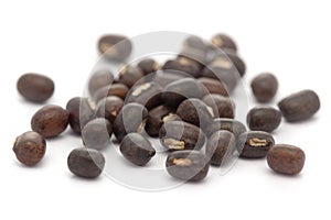 Micro close-up and details of Organic Indian whole black urad dal Vigna mungo isolated over white background