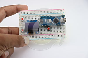 Micro controller and oled display project development, breadboard circuit for prototyping creative projects for engineers