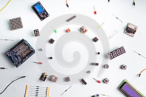 Micro electronics arduino DIY components on a light background, top view
