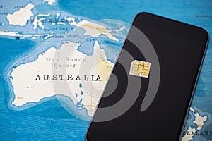 Micro SIM card and smartphone on the world map