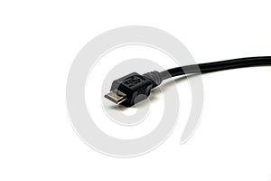 Micro usb black cable put on wooden table, it is small and short For portability. isolated on white background