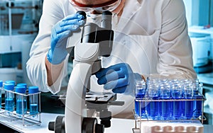 Microscopist scientist working with micro samples in the microbiology lab photo