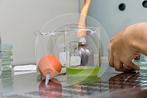 Microbiologist test for test on plate with aseptic technique in a fume hood