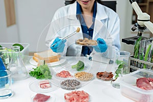 Microbiologists and nutrition experts analyze molecular samples in advanced food science labs