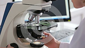 Microbiology laboratory work with microscope