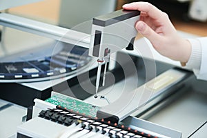 Microchip semiconductor manufacturing. automatic machine robot installing chip on board.