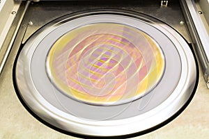A microchip silicon wafer cleaning process that rotates at high speed. The substrate is blurred photo