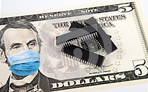 Microchips shortage in the United States because of COVID-19 pandemic. Concept. Picture of computer chips placed on banknote with