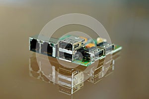 Microcomputer board - electronic components mounted on PCB - printed circuit board with network, phone and USB sockets photo