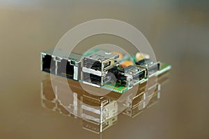 Microcomputer board - electronic components mounted on PCB - printed circuit board with network, phone and USB sockets