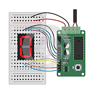 Microcontroller and breadboard circuit with 7-segment display