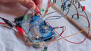 Microcontroller build closeup showing components, board and shield