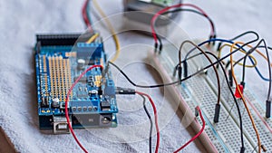 Microcontroller build closeup showing components, board and shield