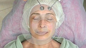 Microcurrent face treatment, adult female.