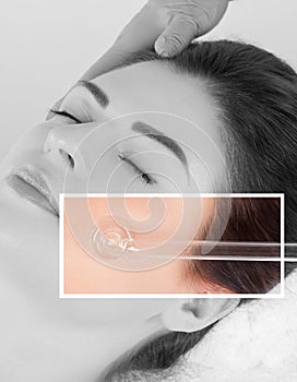 Microcurrent therapy of the facial skin of a beautiful, young woman in a beauty salon.Cosmetology and professional skin care